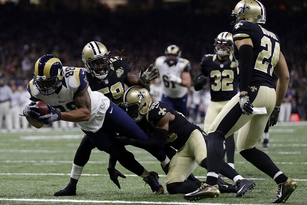 NEW ORLEANS, LA - NOVEMBER 27: Lance Kendricks #88 of the Los Angeles Rams scores a touchdown as Dannell Ellerbe #59 of the New Orleans Saints and Vonn Bell #48 defend during the first half of a game at the Mercedes-Benz Superdome on November 27, 2016 in New Orleans, Louisiana.  (Photo by Sean Gardner/Getty Images)