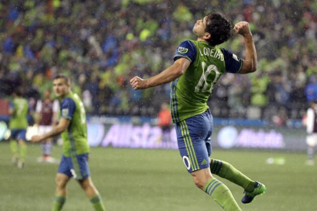 Seattle Sounders forward Nicolas Lodeiro, right, celebrates near forward Jordan Morris, left, after Lodeiro scored a goal against the Colorado Rapids in the second half of the first leg of the MLS soccer Western Conference championship, Tuesday, Nov. 22, 2016, in Seattle. The Sounders beat the Rapids 2-1.(AP Photo/Ted S. Warren)