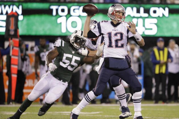 New England Patriots quarterback Tom Brady (12) throws under pressure from New York Jets outside linebacker Lorenzo Mauldin (55) during the third quarter of an NFL football game, Sunday, Nov. 27, 2016, in East Rutherford, N.J. (AP Photo/Julio Cortez)