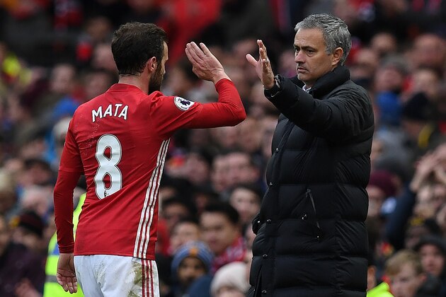 Manchester United's Portuguese manager Jose Mourinho (R) congratulates Manchester United's Spanish midfielder Juan Mata as he is substituted off during the English Premier League football match between Manchester United and Arsenal at Old Trafford in Manchester, north west England, on November 19, 2016. / AFP / Paul ELLIS / RESTRICTED TO EDITORIAL USE. No use with unauthorized audio, video, data, fixture lists, club/league logos or 'live' services. Online in-match use limited to 75 images, no video emulation. No use in betting, games or single club/league/player publications.  /         (Photo credit should read PAUL ELLIS/AFP/Getty Images)