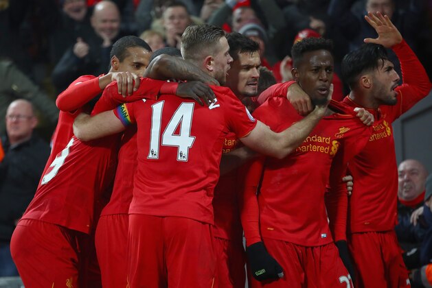LIVERPOOL, ENGLAND - NOVEMBER 26:  Divock Origi (2nd R) of Liverpool celebrates scoring the opening goal with his captain Jordan Henderson (14) and his team mates during the Premier League match between Liverpool and Sunderland at Anfield on November 26, 2016 in Liverpool, England.  (Photo by Clive Brunskill/Getty Images)