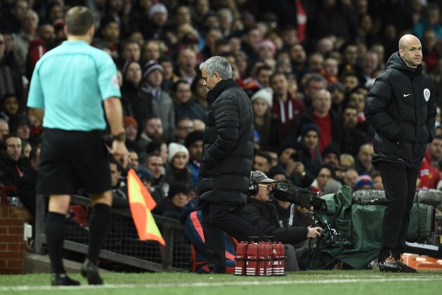 Manchester United's Portuguese manager Jose Mourinho (C) leaves the touchline after referee Jonathan Moss sent him to the stands during the English Premier League football match between Manchester United and West Ham United at Old Trafford in Manchester, north west England, on November 27, 2016. / AFP / Oli SCARFF / RESTRICTED TO EDITORIAL USE. No use with unauthorized audio, video, data, fixture lists, club/league logos or 'live' services. Online in-match use limited to 75 images, no video emulation. No use in betting, games or single club/league/player publications.  /         (Photo credit should read OLI SCARFF/AFP/Getty Images)