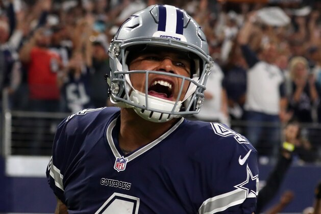 ARLINGTON, TX - NOVEMBER 24:   Dak Prescott #4 of the Dallas Cowboys celebrates after scoring a touchdown during the fourth quarter against the Washington Redskins at AT&T Stadium on November 24, 2016 in Arlington, Texas.  (Photo by Tom Pennington/Getty Images)