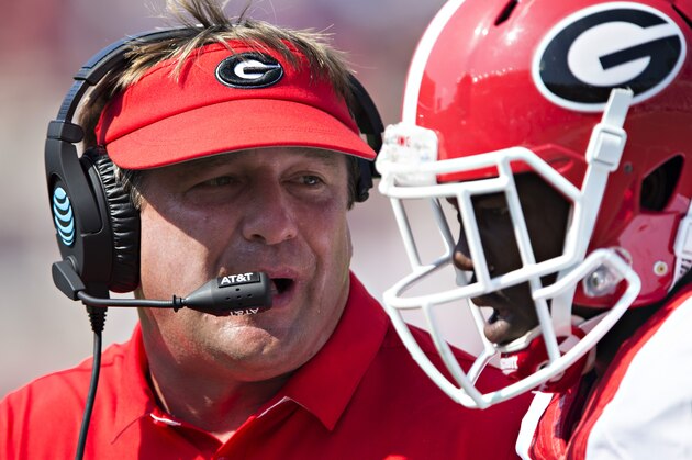 OXFORD, MS - SEPTEMBER 24:  Head Coach Kirby Smart of the Georgia Bulldogs talks with one of his players during a game against the Mississippi Rebels at Vaught-Hemingway Stadium on September 24, 2016 in Oxford, Mississippi.  The Rebels defeated the Bulldogs 45-14.  (Photo by Wesley Hitt/Getty Images)