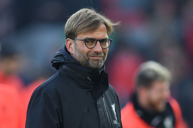 Liverpool's German manager Jurgen Klopp stands on the pitch during the warm up ahead of the English Premier League football match between Liverpool and Sunderland at Anfield in Liverpool, north west England on November 26, 2016. / AFP / Paul ELLIS / RESTRICTED TO EDITORIAL USE. No use with unauthorized audio, video, data, fixture lists, club/league logos or 'live' services. Online in-match use limited to 75 images, no video emulation. No use in betting, games or single club/league/player publications.  /         (Photo credit should read PAUL ELLIS/AFP/Getty Images)
