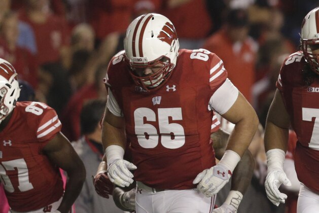MADISON, WI - OCTOBER 15: Wisconsin Badgers Olive Sagapolu #65, Micah Kapoi #75, Michael Deiter #63, Beau Benzschawel #66, and David Edwards #79 of the offensive line take the field during the game against the Ohio State Buckeyes at Camp Randall Stadium on October 15, 2016 in Madison, Wisconsin. (Photo by Mike McGinnis/Getty Images)