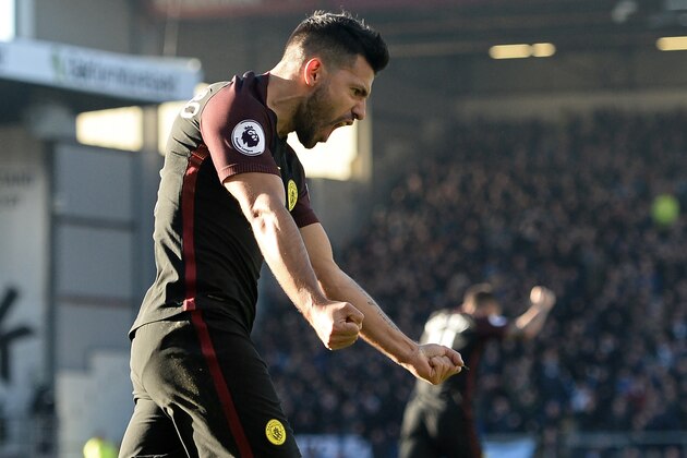Manchester City's Argentinian striker Sergio Aguero celebrates after scoring their first goal during the English Premier League football match between Burnley and Manchester City at Turf Moor in Burnley, north west England on November 26, 2016. / AFP / Oli SCARFF / RESTRICTED TO EDITORIAL USE. No use with unauthorized audio, video, data, fixture lists, club/league logos or 'live' services. Online in-match use limited to 75 images, no video emulation. No use in betting, games or single club/league/player publications.  /         (Photo credit should read OLI SCARFF/AFP/Getty Images)