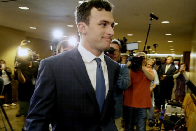 Former Cleveland Browns quarterback Johnny Manziel arrives at court for his initial appearance, Thursday, May 5, 2016, in Dallas. The Heisman Trophy winner and former Texas A&M star was indicted by a grand jury last month after his ex-girlfriend alleged he hit her and threatened to kill her during a night out in January.  (AP Photo/LM Otero)