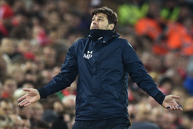 Tottenham Hotspur's Argentinian head coach Mauricio Pochettino gestures on the touchline during the EFL (English Football League) Cup fourth round match between Liverpool and Tottenham Hotspur at Anfield in Liverpool north west England on October 25, 2016. / AFP / Oli SCARFF / RESTRICTED TO EDITORIAL USE. No use with unauthorized audio, video, data, fixture lists, club/league logos or 'live' services. Online in-match use limited to 75 images, no video emulation. No use in betting, games or single club/league/player publications.  /         (Photo credit should read OLI SCARFF/AFP/Getty Images)