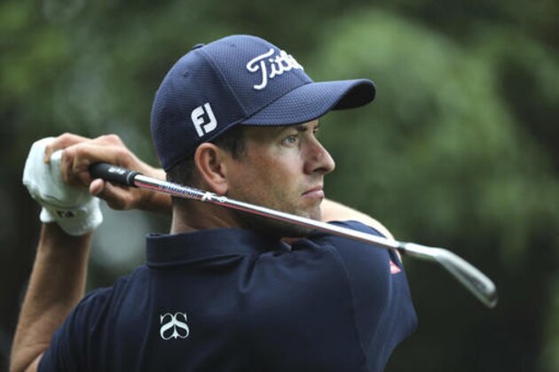 Adam Scott of Australia hits the ball from a sand bank during the WGC-HSBC Champions golf tournament at the Sheshan International Golf Club in Shanghai, China, Thursday, Oct. 27, 2016. (AP Photo/Ng Han Guan)