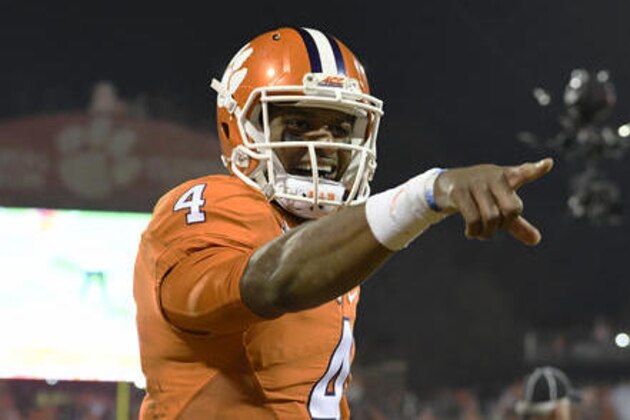 Clemson quarterback Deshaun Watson reacts after throwing a touchdown pass to Artavis Scott during the second half of an NCAA college football game against South Carolina Saturday, Nov. 26, 2016, in Clemson, S.C. (AP Photo/Richard Shiro)