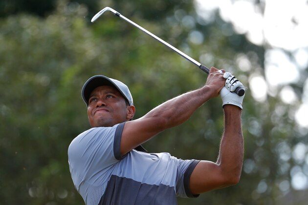 GREENSBORO, NC - AUGUST 22:  Tiger Woods tees off the 16th hole during the third round of the Wyndham Championship at Sedgefield Country Club on August 22, 2015 in Greensboro, North Carolina.  (Photo by Kevin C. Cox/Getty Images)