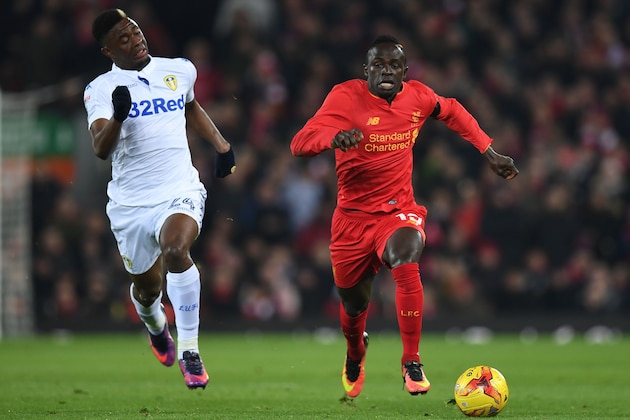 Leeds United's French midfielder Hadi Sacko (L) vies with Liverpool's Senegalese midfielder Sadio Mane during the English League Cup quarter-final football match between Liverpool and Leeds United at Anfield in Liverpool, north west England on November 29, 2016. / AFP / Paul ELLIS / RESTRICTED TO EDITORIAL USE. No use with unauthorized audio, video, data, fixture lists, club/league logos or 'live' services. Online in-match use limited to 75 images, no video emulation. No use in betting, games or single club/league/player publications.  /         (Photo credit should read PAUL ELLIS/AFP/Getty Images)