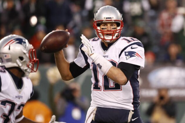 New England Patriots quarterback Tom Brady (12) looks to pass to running back Dion Lewis (33) during the first quarter of an NFL football game, Sunday, Nov. 27, 2016, in East Rutherford, N.J. (AP Photo/Julio Cortez)