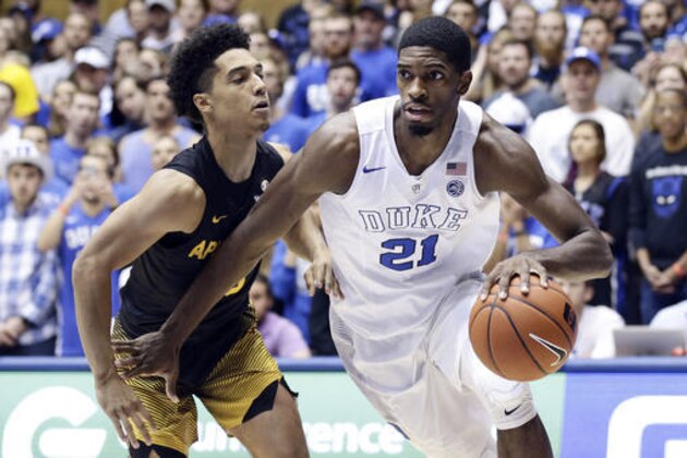 Duke's Amile Jefferson (21) drives to the basket against Appalachian State's Patrick Good during the first half of an NCAA college basketball game in Durham, N.C., Saturday, Nov. 26, 2016. (AP Photo/Gerry Broome)