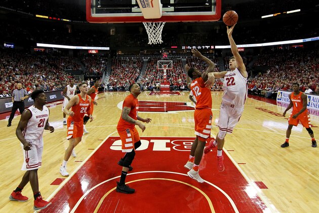 MADISON, WI - NOVEMBER 29:  Ethan Happ #22 of the Wisconsin Badgers attempts a shot over Taurean Thompson #12 of the Syracuse Orange in the first half at the Kohl Center on November 29, 2016 in Madison, Wisconsin. (Photo by Dylan Buell/Getty Images)