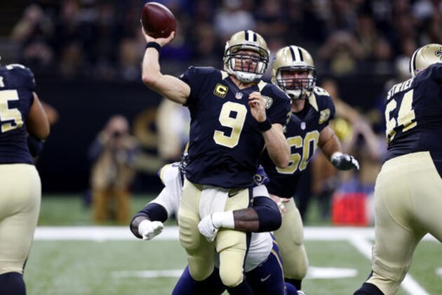 New Orleans Saints quarterback Drew Brees (9) passes under pressure from Los Angeles Rams defensive tackle Michael Brockers in the first half of an NFL football game in New Orleans, Sunday, Nov. 27, 2016. (AP Photo/Butch Dill)