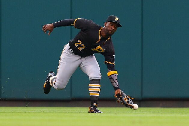 ST. LOUIS, MO - OCTOBER 2: Andrew McCutchen #22 of the Pittsburgh Pirates misplays a fly ball against the St. Louis Cardinals in the third inning at Busch Stadium on October 2, 2016 in St. Louis, Missouri.  (Photo by Dilip Vishwanat/Getty Images)