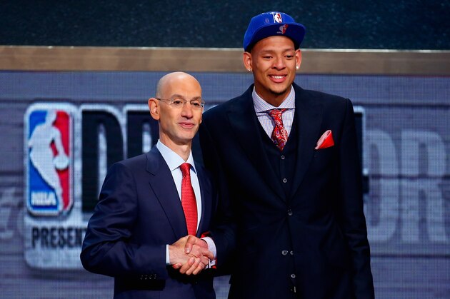 NEW YORK, NY - JUNE 26:  Isaiah Austin of Baylor (R) shakes hands with NBA Commissioner Adam Silver as he is honored on stage during the 2014 NBA Draft at Barclays Center on June 26, 2014 in the Brooklyn borough of New York City. NOTE TO USER: User expressly acknowledges and agrees that, by downloading and/or using this Photograph, user is consenting to the terms and conditions of the Getty Images License Agreement.  (Photo by Mike Stobe/Getty Images)