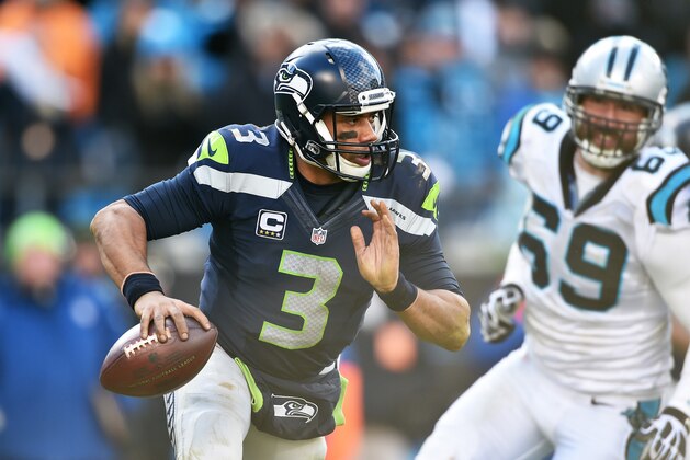 CHARLOTTE, NC - JANUARY 17:  Quarterback Russell Wilson #3 of the Seattle Seahawks scrambles during the NFC Divisional Playoff Game against the Carolina Panthers at Bank of America Stadium on January 17, 2016 in Charlotte, North Carolina.  (Photo by Ronald C. Modra/Sports Imagery/Getty Images)