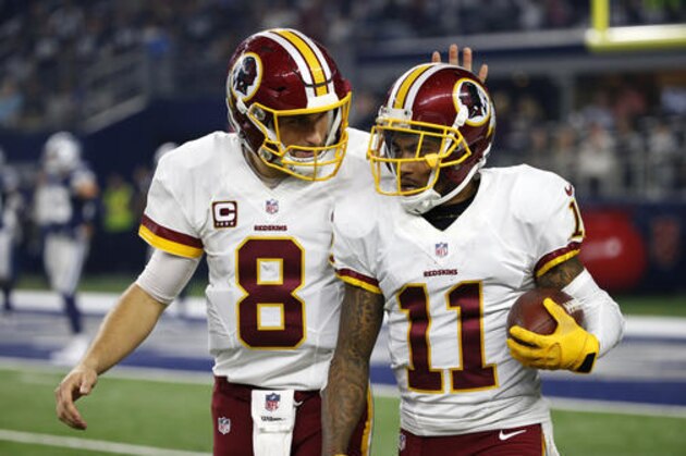 Washington Redskins quarterback Kirk Cousins (8) and wide receiver DeSean Jackson (11) celebrate a touchdown scored by Jackson on a pass from Cousins in the second half of an NFL football game against the Dallas Cowboys on Thursday, Nov. 24, 2016, in Arlington, Texas. (AP Photo/Michael Ainsworth)