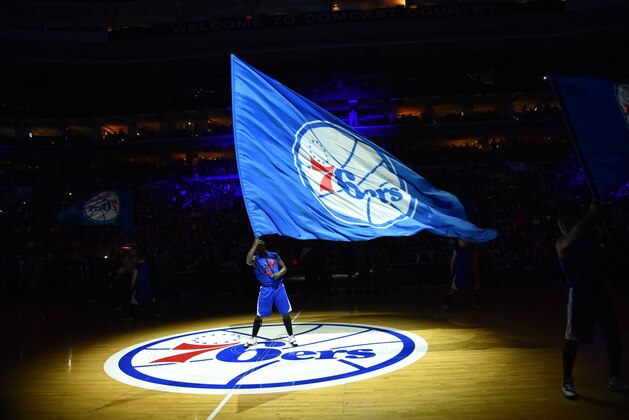 PHILADELPHIA, PA - JANUARY 10: A member of the Philadelphia 76ers dance team holds the team flag logo against the Indiana Pacers at Wells Fargo Center on January 10, 2015 in Philadelphia, Pennsylvania NOTE TO USER: User expressly acknowledges and agrees that, by downloading and/or using this Photograph, user is consenting to the terms and conditions of the Getty Images License Agreement. Mandatory Copyright Notice: Copyright 2015 NBAE (Photo by Jesse D. Garrabrant/NBAE via Getty Images)