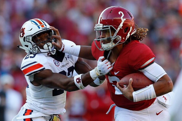 TUSCALOOSA, AL - NOVEMBER 26: Jalen Hurts #2 of the Alabama Crimson Tide tries to break a tackle by Johnathan Ford #23 of the Auburn Tigers at Bryant-Denny Stadium on November 26, 2016 in Tuscaloosa, Alabama. (Photo by Kevin C. Cox/Getty Images) TUSCALOOSA, AL - NOVEMBER 26: Jalen Hurts #2 of the Alabama Crimson Tide tries to break a tackle by Johnathan Ford #23 of the Auburn Tigers at Bryant-Denny Stadium on November 26, 2016 in Tuscaloosa, Alabama. (Photo by Kevin C. Cox/Getty Images)