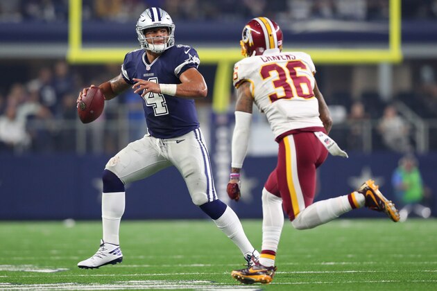 ARLINGTON, TX - NOVEMBER 24:   Dak Prescott #4 of the Dallas Cowboys rolls out to pass during the fourth quarter against the Washington Redskins at AT&T Stadium on November 24, 2016 in Arlington, Texas.  (Photo by Tom Pennington/Getty Images)