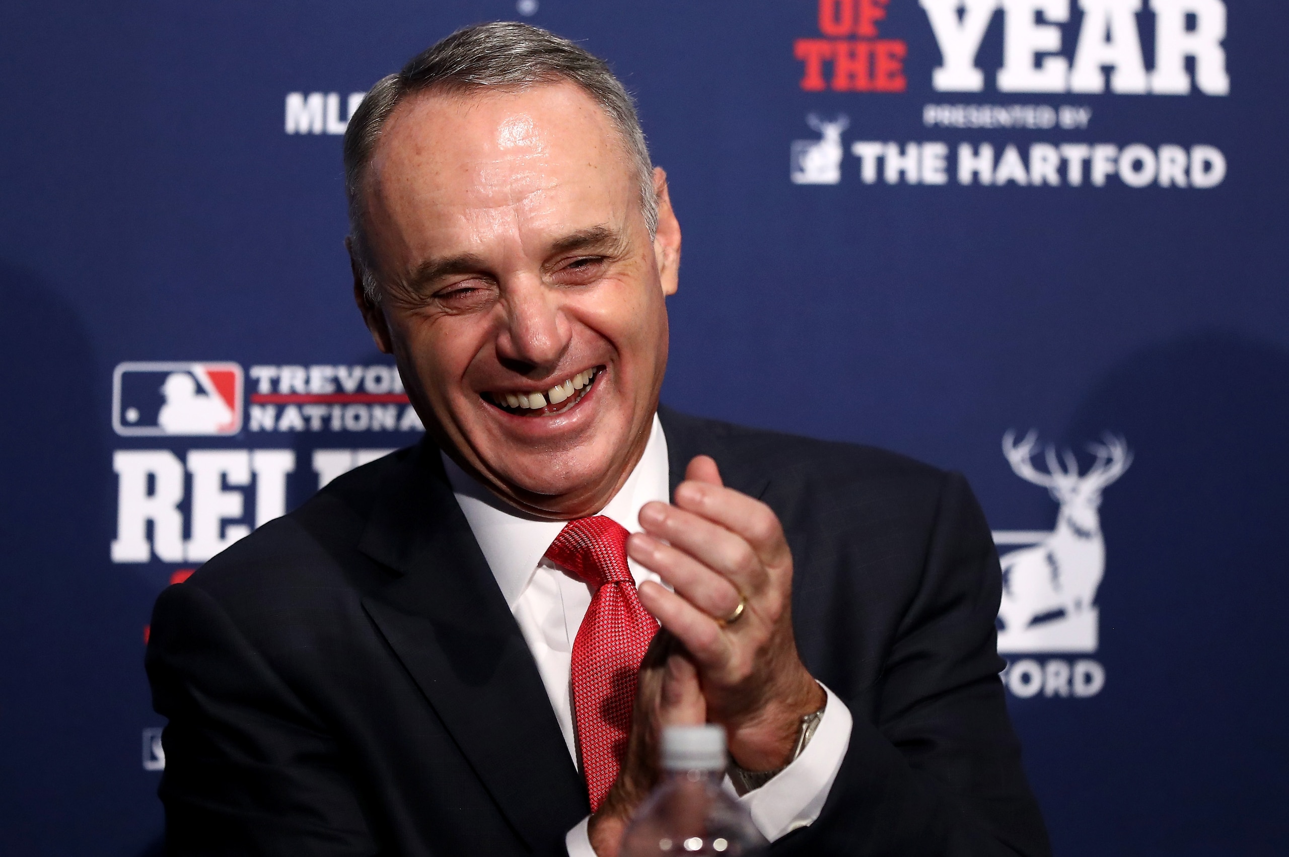 CHICAGO, IL - OCTOBER 29:  MLB Commissioner Rob Manfred laughs during a ceremony naming the 2016 winners of the Mariano Rivera American League Reliever of the Year Award and the Trevor Hoffman National League Reliever of the Year Award before Game Four of the 2016 World Series between the Chicago Cubs and the Cleveland Indians at Wrigley Field on October 29, 2016 in Chicago, Illinois.  (Photo by Elsa/Getty Images)