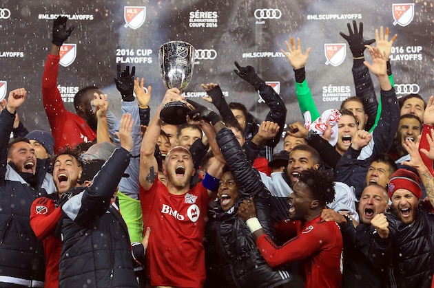 TORONTO, ON - NOVEMBER 30:  Michael Bradley #4 of Toronto FC and teammates celebrate with the Eastern Conference Trophy following the MLS Eastern Conference Final, Leg 2 game against Montreal Impact at BMO Field on November 30, 2016 in Toronto, Ontario, Canada.  (Photo by Vaughn Ridley/Getty Images)
