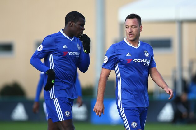 COBHAM, ENGLAND - NOVEMBER 21: Kurt Zouma of Chelsea (L) and John Terry (R) speak during the Premier League 2 match between Chelsea and Southampton at Chelsea Training Ground on November 21, 2016 in Cobham, England.  (Photo by Alex Pantling/Getty Images)