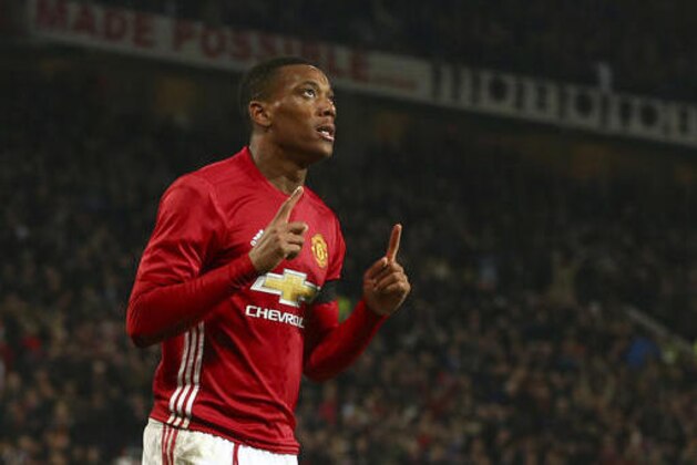 Manchester United's Anthony Martial celebrates after scoring his sides 3rd goal and his second of the game during the English League Cup quarterfinal soccer match between manchester United and West Ham United at Old Trafford in Manchester, England Wednesday, Nov. 30, 2016. (AP Photo/Dave Thompson)