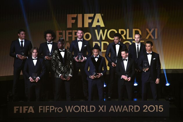 TOPSHOT - (From L) Brazil and Paris Saint-Germain defender Thiago Silva, Croatia and Real Madrid midfielder Luka Modric, Brazil and Real Madrid defender Marcelo, France and Juventus midfielder Paul Pogba, Spain and Real Madrid defender Sergio Ramos, Brazil and FC Barcelona forward Neymar, Brazil and FC Barcelona defender Dani Alves, Argentina and FC Barcelona forward Lionel Messi, Spain and FC Barcelona midfielder Andres Iniesta and Portugal and Real Madrid forward Cristiano Ronaldo pose on stage  after being selected in the 2015 FIFA FIFPro World XI during the 2015 FIFA Ballon d'Or award ceremony at the Kongresshaus in Zurich on January 11, 2016. AFP PHOTO / OLIVIER MORIN / AFP / OLIVIER MORIN        (Photo credit should read OLIVIER MORIN/AFP/Getty Images)
