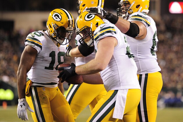 PHILADELPHIA, PA - NOVEMBER 28: Aaron Ripkowski #22 of the Green Bay Packers (C) is celebrated by Randall Cobb #18 and other teammates after a touchdown in the second half against the Philadelphia Eagles at Lincoln Financial Field on November 28, 2016 in Philadelphia, Pennsylvania. Green Bay won 27-13. (Photo by Corey Perrine/Getty Images)