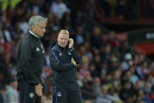 Everton's Dutch manager Ronald Koeman (R) reacts on the touchline next to Manchester United's Portuguese manager Jose Mourinho (L) during the friendly Wayne Rooney testimonial football match between Manchester United and Everton at Old Trafford in Manchester, northwest England, on August 3, 2016.  / AFP / OLI SCARFF        (Photo credit should read OLI SCARFF/AFP/Getty Images)