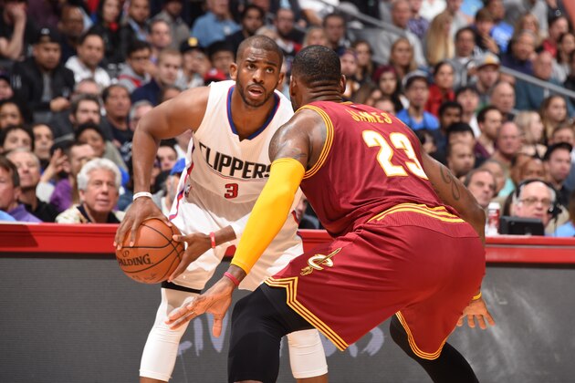 LOS ANGELES, CA  - MARCH 13: Chris Paul #3 of the Los Angeles Clippers defends the ball against LeBron James #23 of the Cleveland Cavaliersduring the game on March 13, 2016 at STAPLES Center in Los Angeles, California. NOTE TO USER: User expressly acknowledges and agrees that, by downloading and or using this Photograph, user is consenting to the terms and conditions of the Getty Images License Agreement. Mandatory Copyright Notice: Copyright 2016 NBAE (Photo by Andrew Bernstein/NBAE via Getty Images)a