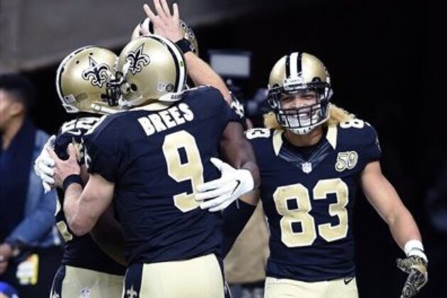 New Orleans Saints quarterback Drew Brees (9) celebrates his touchdown pass in the first half of an NFL football game against the Los Angeles Rams in New Orleans, Sunday, Nov. 27, 2016. (AP Photo/Bill Feig)