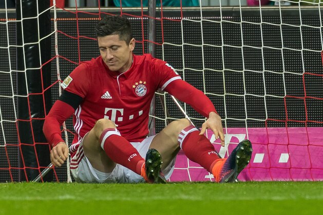 MUNICH, GERMANY - NOVEMBER 26: Robert Lewandowski of Bayern Muenchen on the ground during the Bundesliga match between FC Bayern Muenchen and Bayer 04 Leverkusen at Allianz Arena on November 26 , 2016 in Munich, Germany. (Photo by TF-Images/Getty Images)