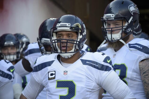 Seattle Seahawks quarterback Russell Wilson (3) prepares to lead the team onto the field before an NFL football game against the Tampa Bay Buccaneers in Tampa, Fla., Sunday, Nov. 27, 2016. (AP Photo/Phelan M. Ebenhack)