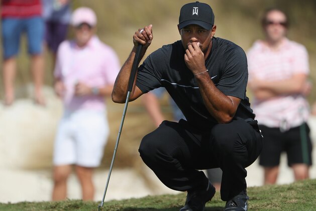 NASSAU, BAHAMAS - DECEMBER 01:  Tiger Woods of the United States reacts on the first green during round one of the Hero World Challenge at Albany, The Bahamas on December 1, 2016 in Nassau, Bahamas.  (Photo by Christian Petersen/Getty Images)