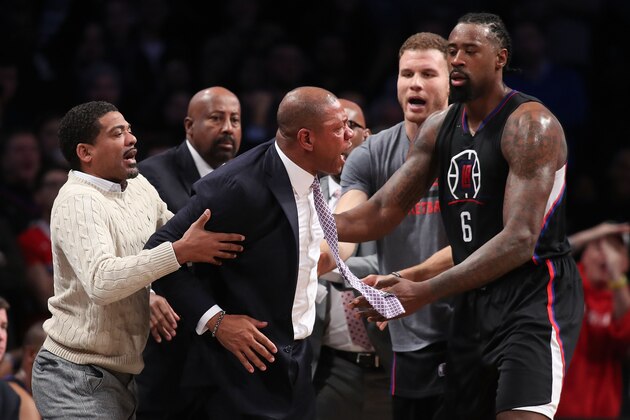 NEW YORK, NY - NOVEMBER 29:  Head coach Doc Rivers of the Los Angeles Clippers is held back by DeAndre Jordan #6 and Blake Griffin #32 after a technical foul call against the Brooklyn Nets in overtime at Barclays Center on November 29, 2016 in the Brooklyn borough of New York City. NOTE TO USER: User expressly acknowledges and agrees that, by downloading and or using this photograph, User is consenting to the terms and conditions of the Getty Images License Agreement.  (Photo by Michael Reaves/Getty Images)