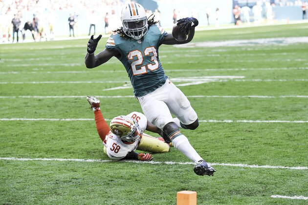 MIAMI GARDENS, FL - NOVEMBER 27:  Running back Jay Ajayi #23 of the Miami Dolphins carries the ball during a NFL game against the San Francisco 49ers on November 27, 2016 at Hard Rock Stadium in Miami Gardens, Florida.  (Photo by Ron Elkman/Sports Imagery/Getty Images)