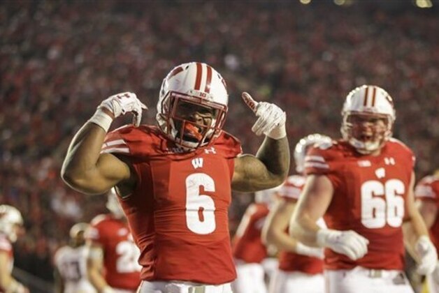 Wisconsin running back Corey Clement celebrates a touchdown against Minnesota during the second half of an NCAA college football game Saturday, Nov. 26, 2016, in Madison, Wis. Wisconsin won 31-17. (AP Photo/Andy Manis)
