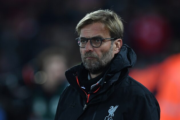 Liverpool's German manager Jurgen Klopp watches his players warm up ahead of the EFL (English Football League) Cup quarter-final football match between Liverpool and Leeds United at Anfield in Liverpool, north west England on November 29, 2016. / AFP / Paul ELLIS / RESTRICTED TO EDITORIAL USE. No use with unauthorized audio, video, data, fixture lists, club/league logos or 'live' services. Online in-match use limited to 75 images, no video emulation. No use in betting, games or single club/league/player publications.  /         (Photo credit should read PAUL ELLIS/AFP/Getty Images)