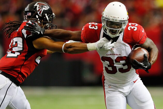 ATLANTA, GA - NOVEMBER 27: David Johnson #31 of the Arizona Cardinals runs through a tackle by Keanu Neal #22 of the Atlanta Falcons during the first half at the Georgia Dome on November 27, 2016 in Atlanta, Georgia. (Photo by Kevin C.  Cox/Getty Images)