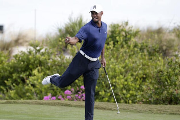 Tiger Woods reacts after saving par on the 16th hole during the second round at the Hero World Challenge golf tournament, Friday, Dec. 2, 2016, in Nassau, Bahamas. (AP Photo/Lynne Sladky)