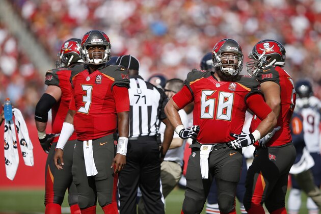 TAMPA, FL - DECEMBER 27: Jameis Winston #3 and Joe Hawley #68 of the Tampa Bay Buccaneers watch a replay on the video board during the game against the Chicago Bears at Raymond James Stadium on December 27, 2015 in Tampa, Florida. The Bears defeated the Buccaneers 26-21. (Photo by Joe Robbins/Getty Images)