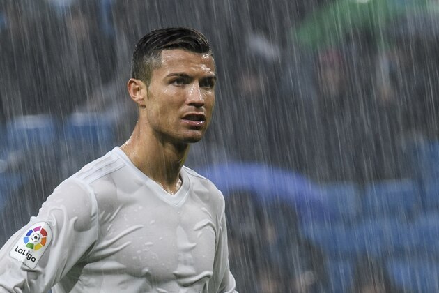 MADRID, SPAIN - NOVEMBER 26: Cristiano Ronaldo of Real Madrid looks on under the rain during the La Liga match between Real Madrid and Real Sporting de Gijon at the Santiago Bernabeu Stadium on 26 November 2016 in Madrid, Spain. (Photo by Power Sport Images/Getty Images)