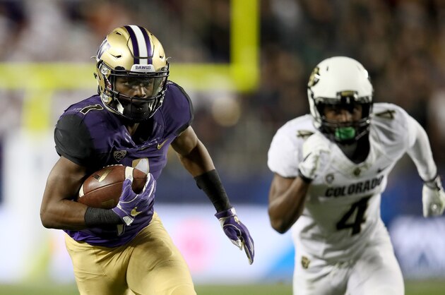 SANTA CLARA, CA - DECEMBER 02:  John Ross #1 of the Washington Huskies gets past Chidobe Awuzie #4 of the Colorado Buffaloes on his way to scoring a touchdown during the Pac-12 Championship game at Levi's Stadium on December 2, 2016 in Santa Clara, California.  (Photo by Robert Reiners/Getty Images)