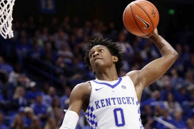 FILE - In this Nov. 6, 2016, file photo, Kentucky's De'Aaron Fox goes up for a dunk during the second half of an NCAA college basketball exhibition game against Asbury, in Lexington, Ky. Kentucky’s John Calipari landed five of the nation’s top 24 prospects according to composite rankings of recruiting websites compiled by 247Sports. The new Wildcats include guards De’Aaron Fox, Malik Monk, Bam Adebayo, Wenyen Gabriel and Sacha Killeya-Jones. (AP Photo/James Crisp, File)
